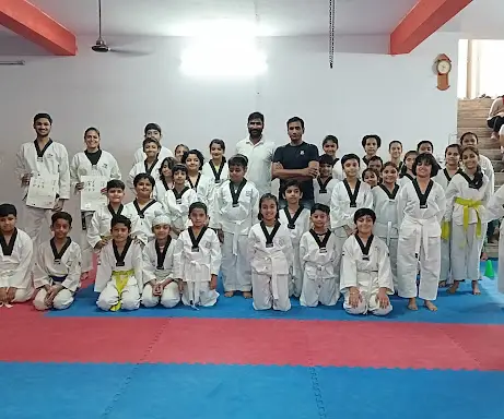 Om's Martial Arts Academy group photo with students and coaches